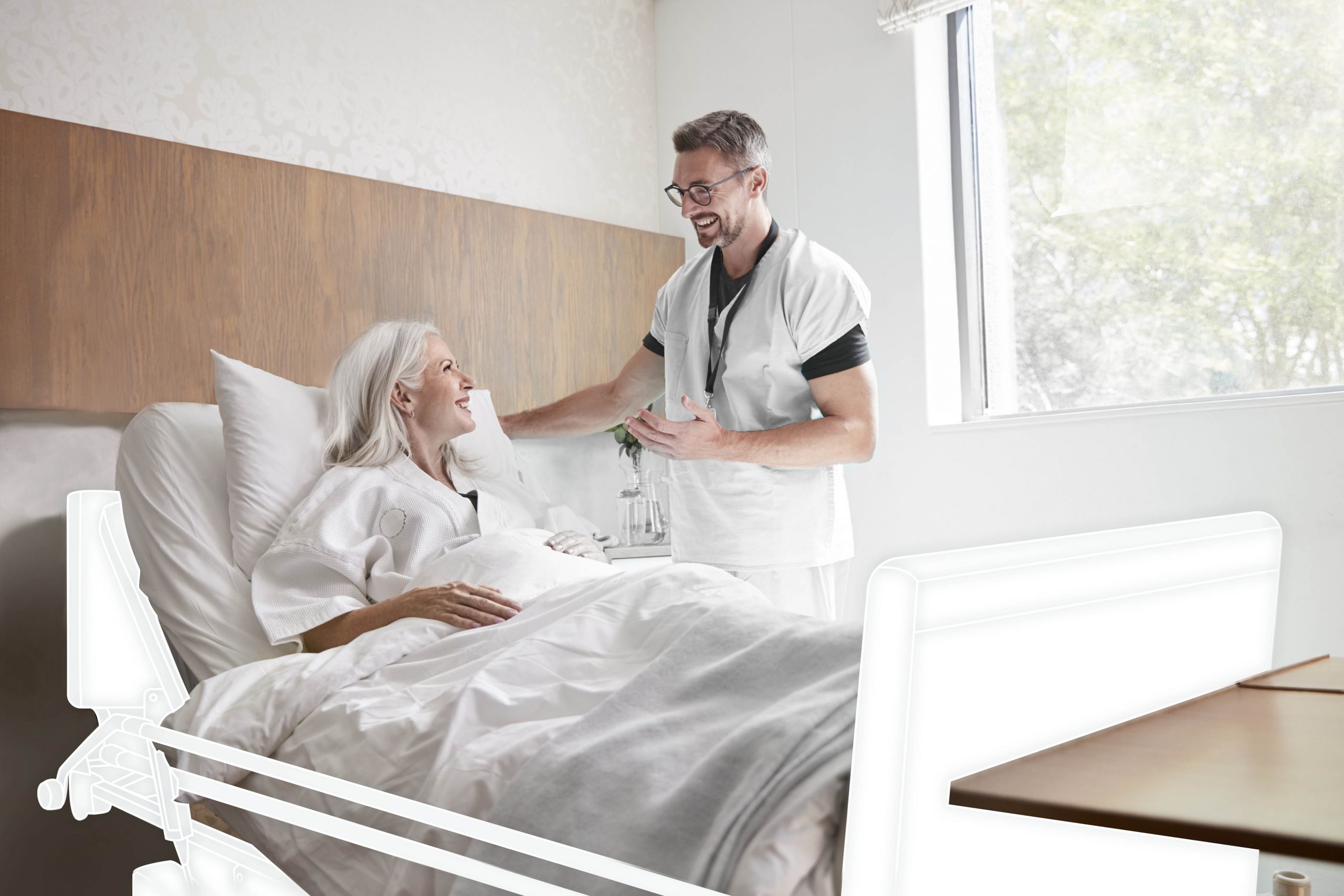 Surgeon Visiting And Talking With Mature Female Patient In Hospital Bed